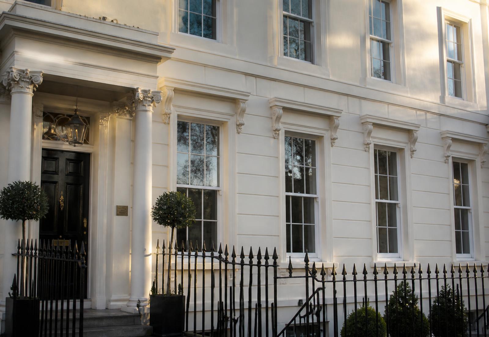 Restored timber sash windows on a Regency townhouse in Montpellier, Cheltenham